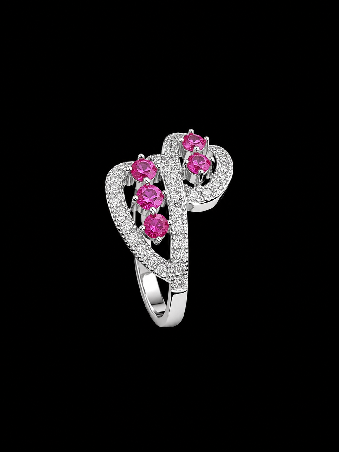 A silver ring with a heart-shaped design and pink CZ stones.