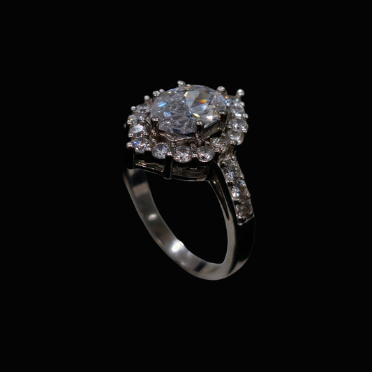 A silver ring with a floral design and clear CZ stones.