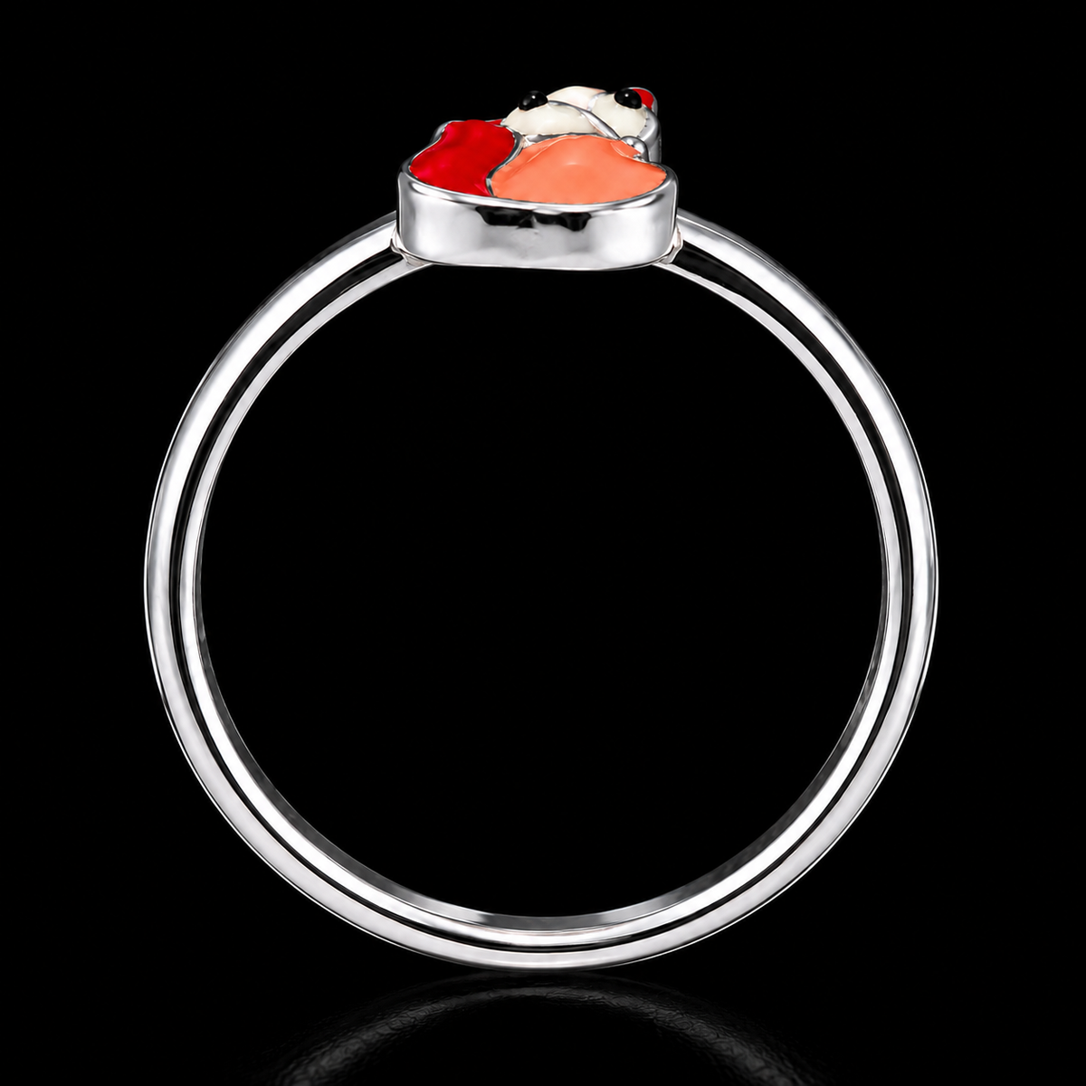A silver ring with an enamel design and CZ stones, set against a dark background.