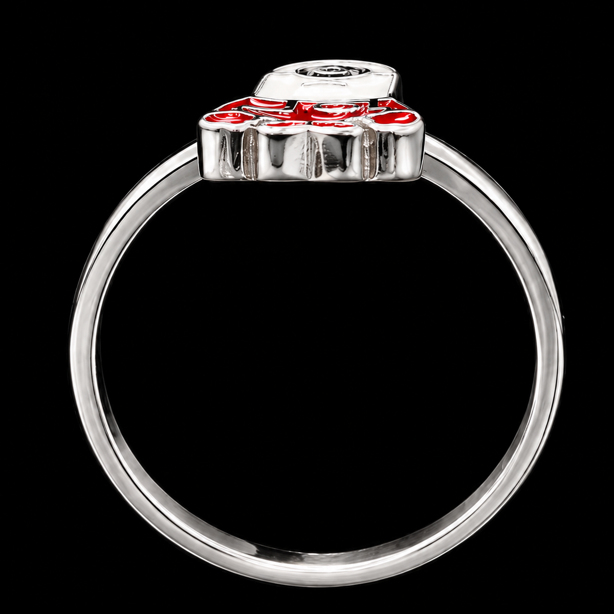 A silver-tone ring with a red enamel flower design.