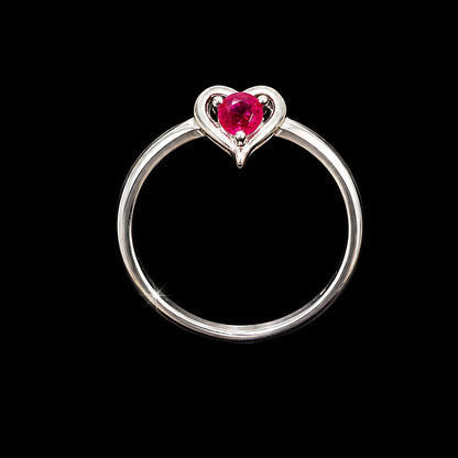A silver ring with a heart-shaped design and a pink CZ stone at its center.