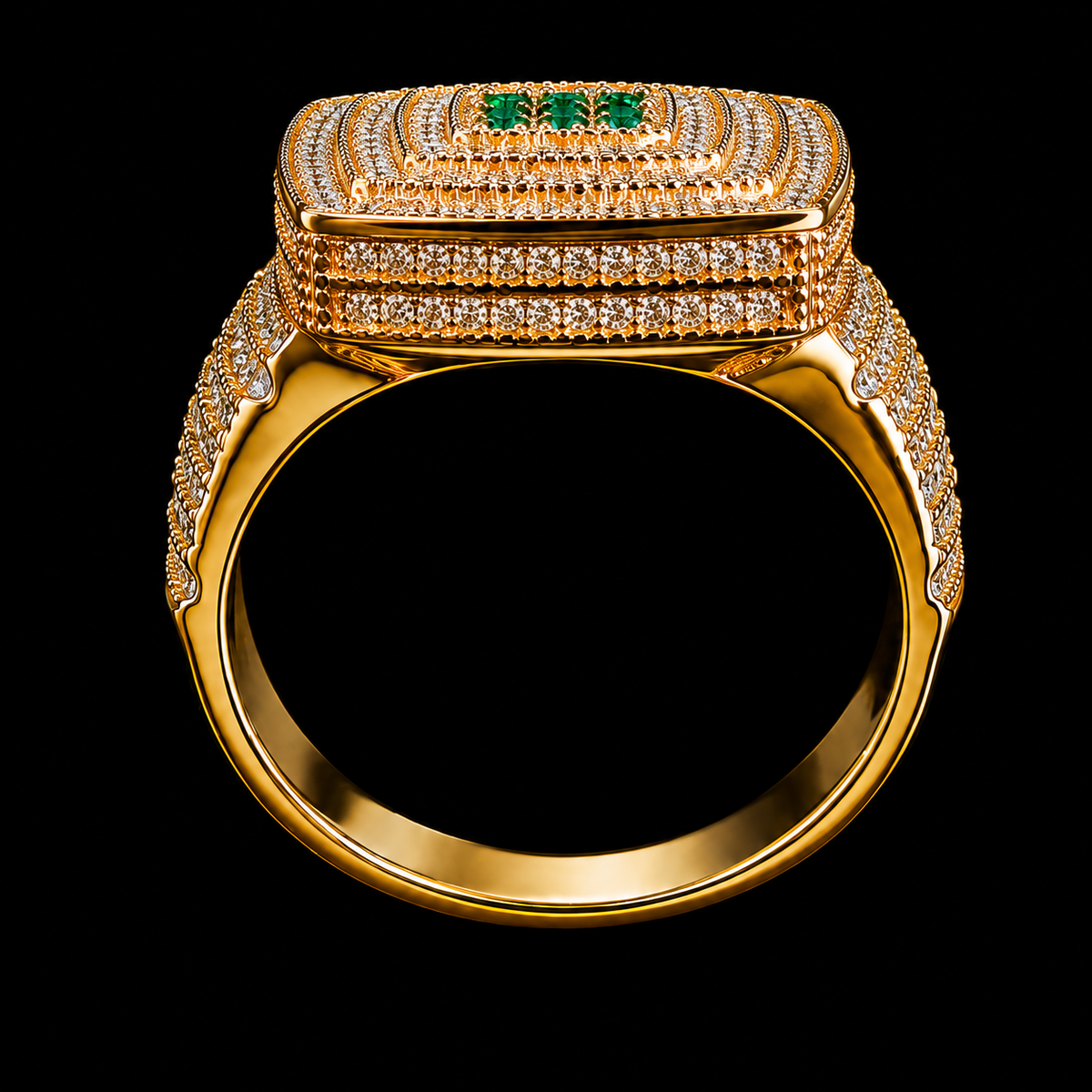 A gold ring with intricate CZ stones and emeralds on a black background