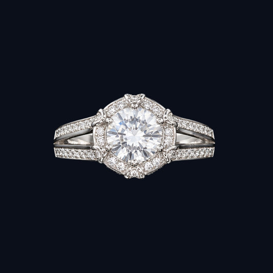 A silver ring with a round-cut clear CZ stone at its center, surrounded by smaller CZ stones in a delicate filigree design.