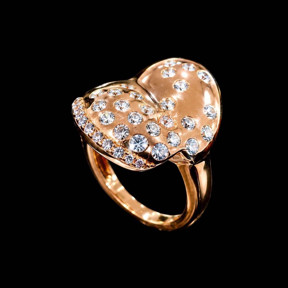 A rose gold ring with a heart-shaped design and clear CZ stones.