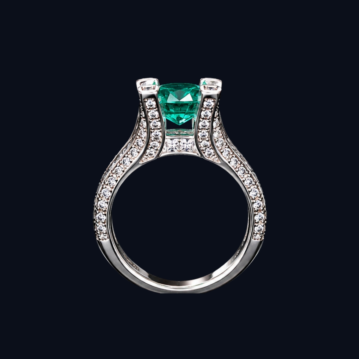 A silver ring with an emerald stone and CZ stones