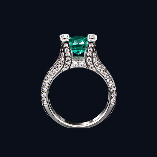 A silver ring with an emerald stone and CZ stones