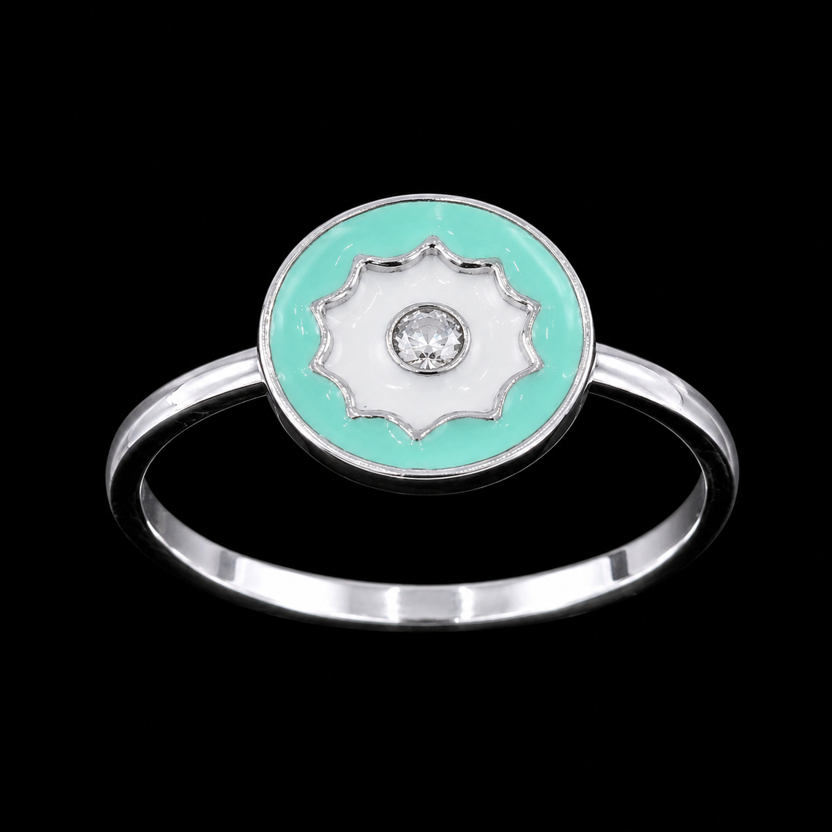 A silver ring with an enamel flower design and a CZ stone in the center, set against a black background.