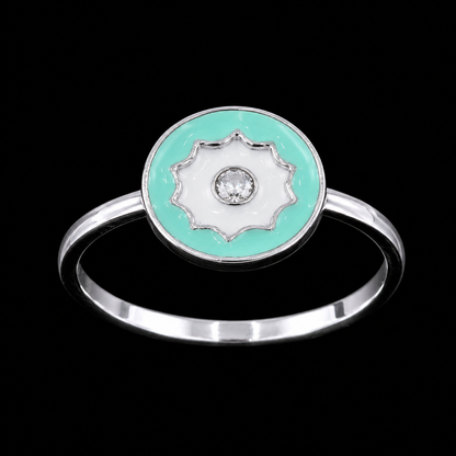 A silver ring with an enamel flower design and a CZ stone in the center, set against a black background.