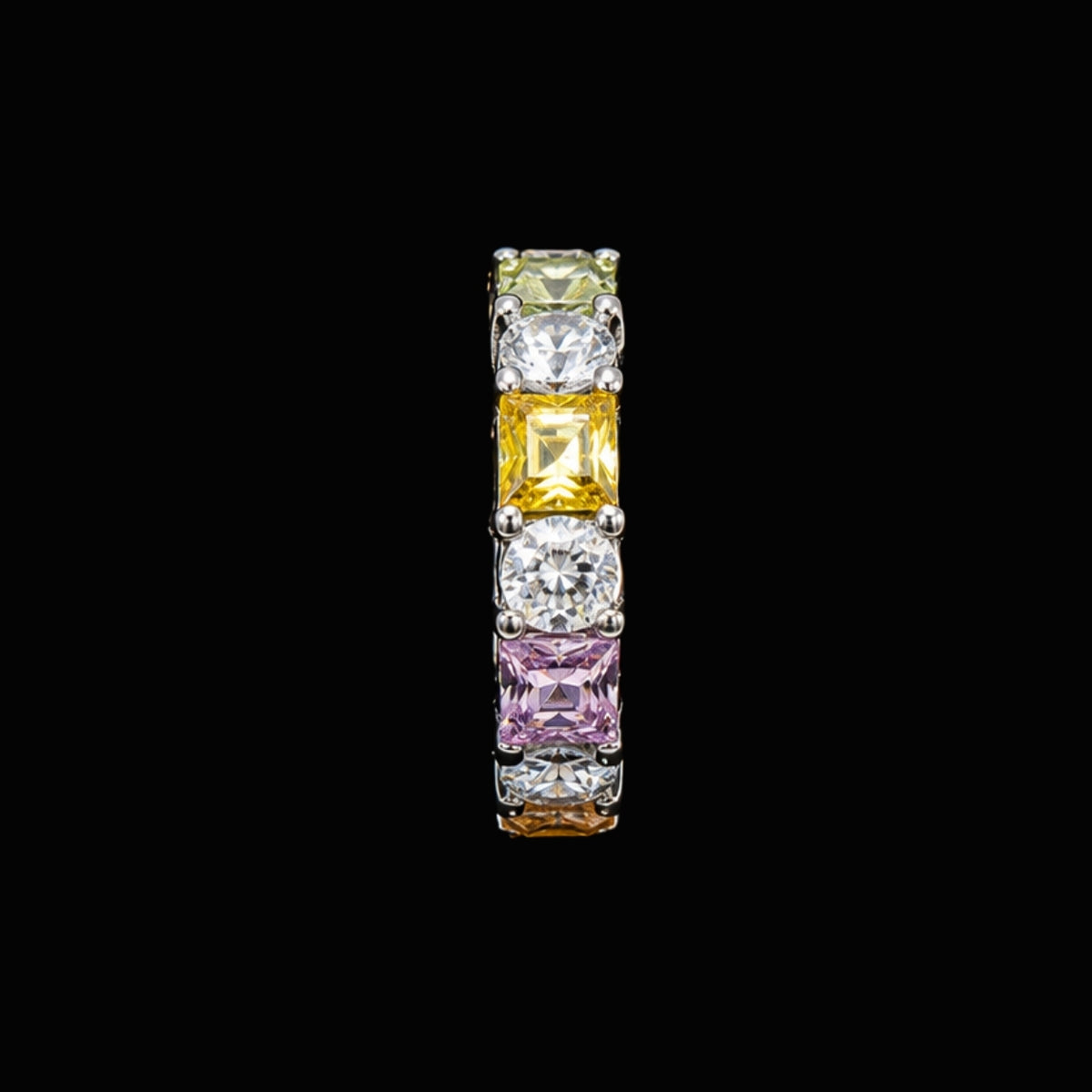 A silver-tone ring with clear, yellow, and pink CZ stones.