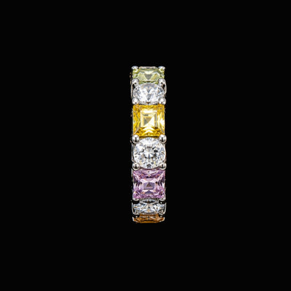 A silver-tone ring with clear, yellow, and pink CZ stones.