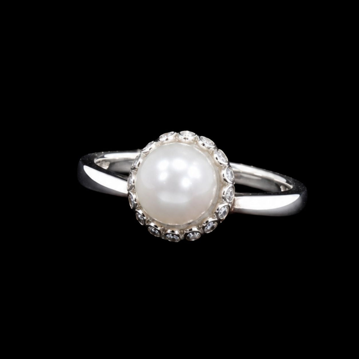 A silver-tone ring with a pearl and clear CZ stones
