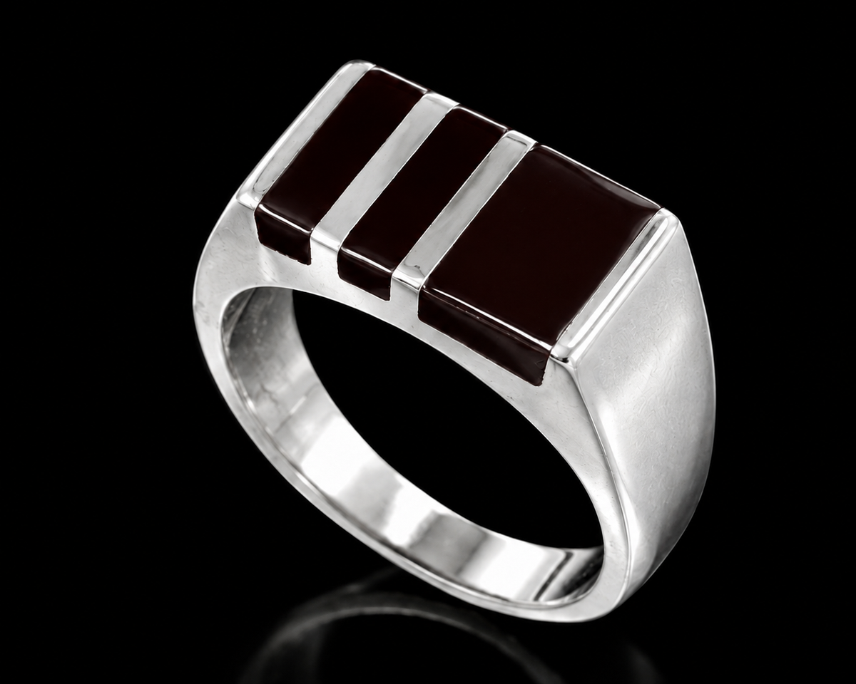 A silver ring with three black enamel stripes, each separated by a silver strip.