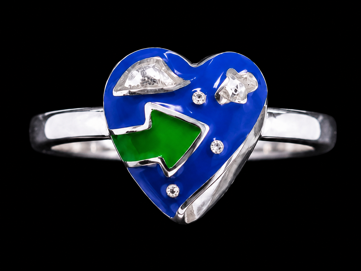 A silver ring with a heart-shaped design and CZ stones and enamel work.
