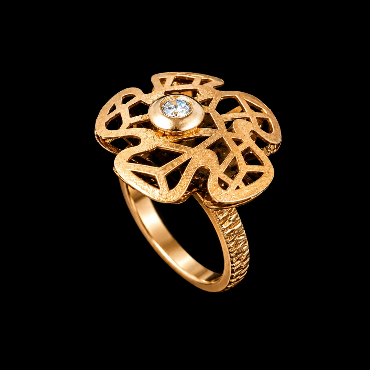 A gold-tone ring with a CZ stone and floral design.