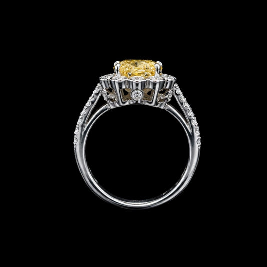 A silver-tone ring with a large yellow CZ stone, set in a modern design.