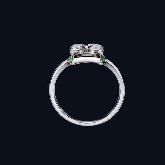 A silver ring with two round-cut cubic zirconia stones, set in a sleek and modern design.