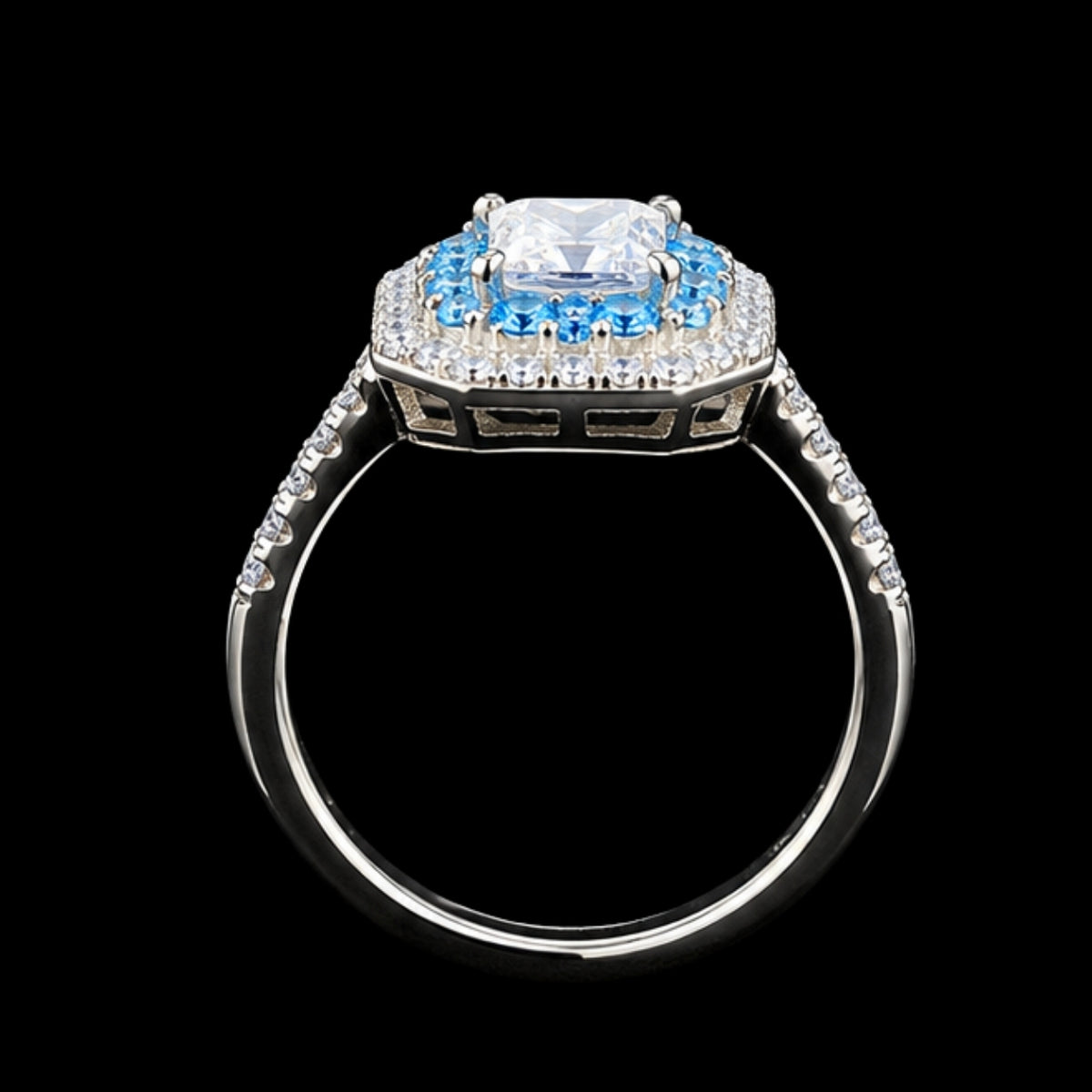 A square-cut CZ stone ring with a blue and white CZ stone halo and silver-tone metal.
