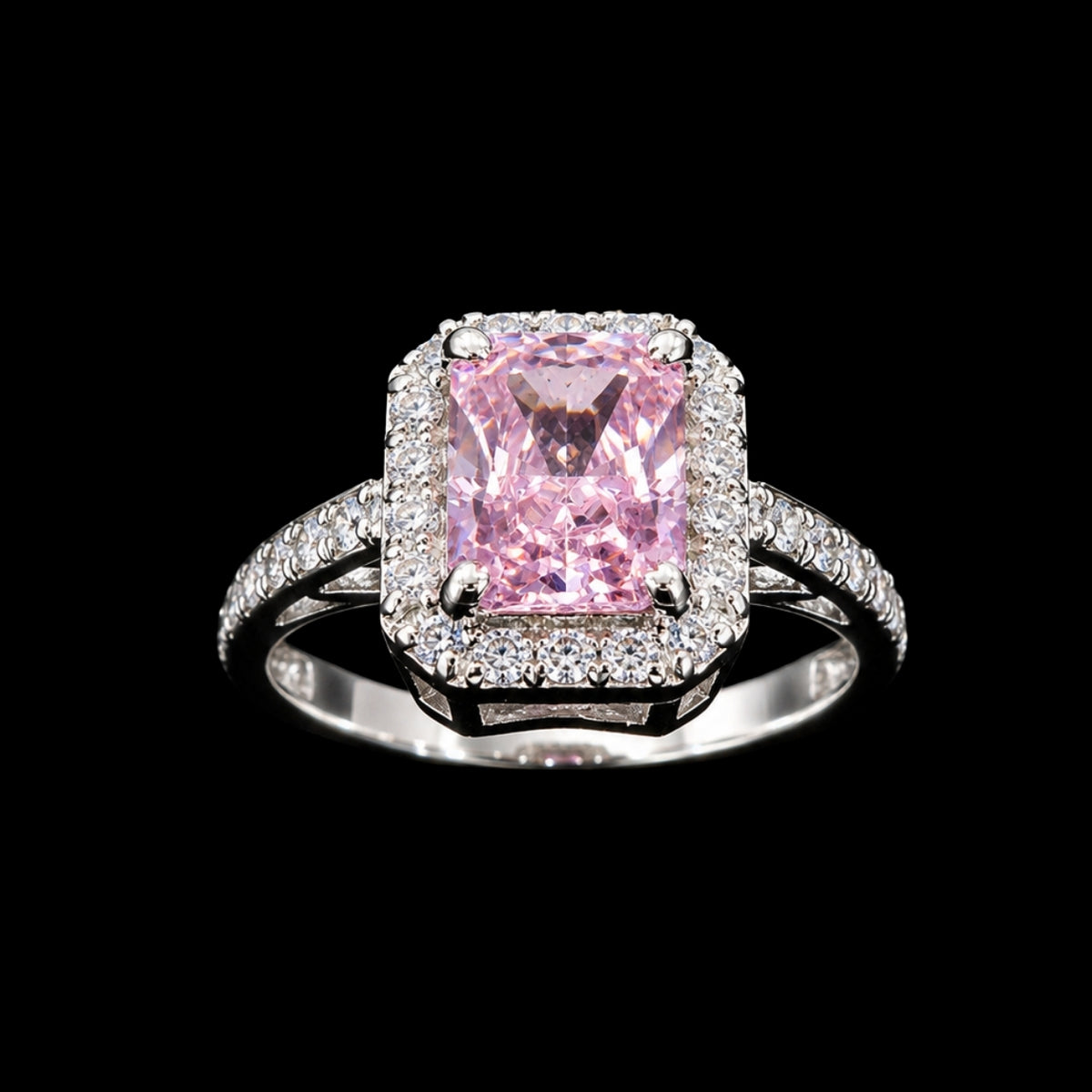 A silver ring with a large pink CZ stone and a halo of smaller stones.