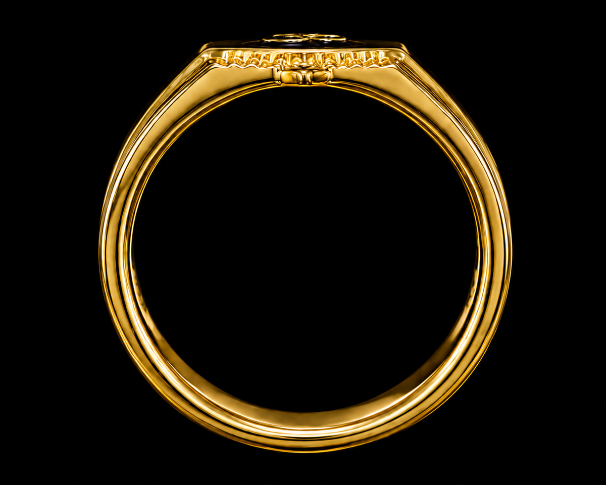 A gold signet ring with a flat top and rounded edges, set against a plain background.