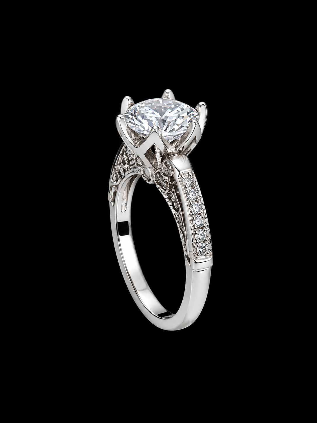 A silver-tone ring with a large round-cut cubic zirconia stone and ornate filigree details.