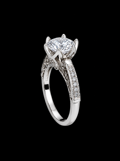 A silver-tone ring with a large round-cut cubic zirconia stone and ornate filigree details.