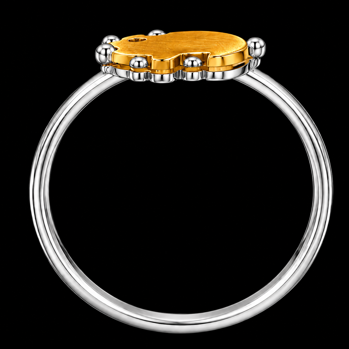 A gold-tone ring with a silver-tone band, featuring a geometric design and CZ stones.