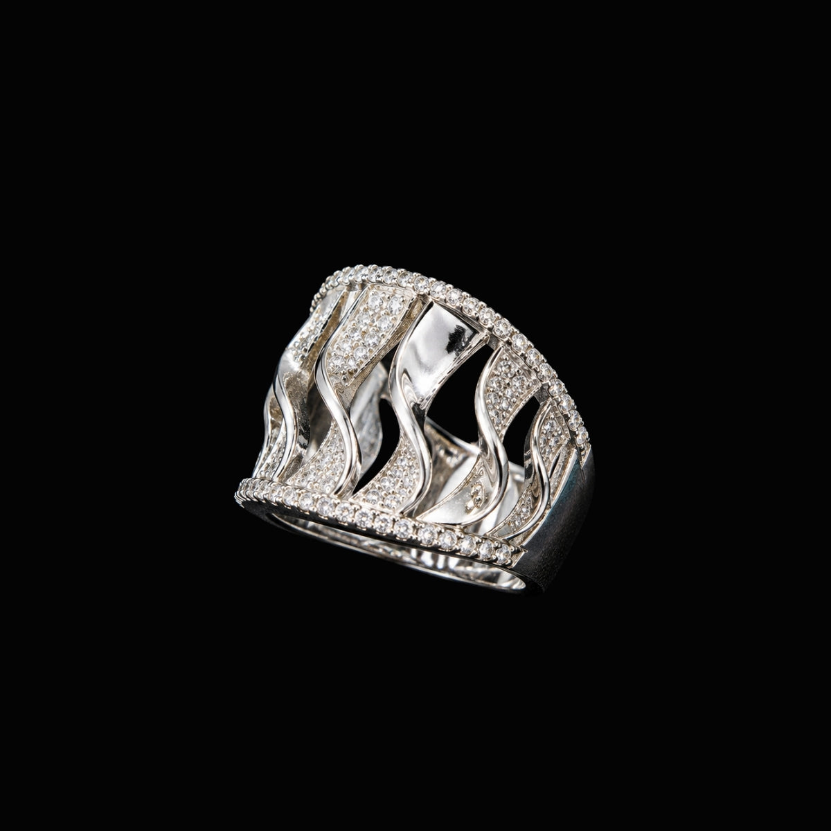 A silver-tone ring with cut-out details and CZ stones.