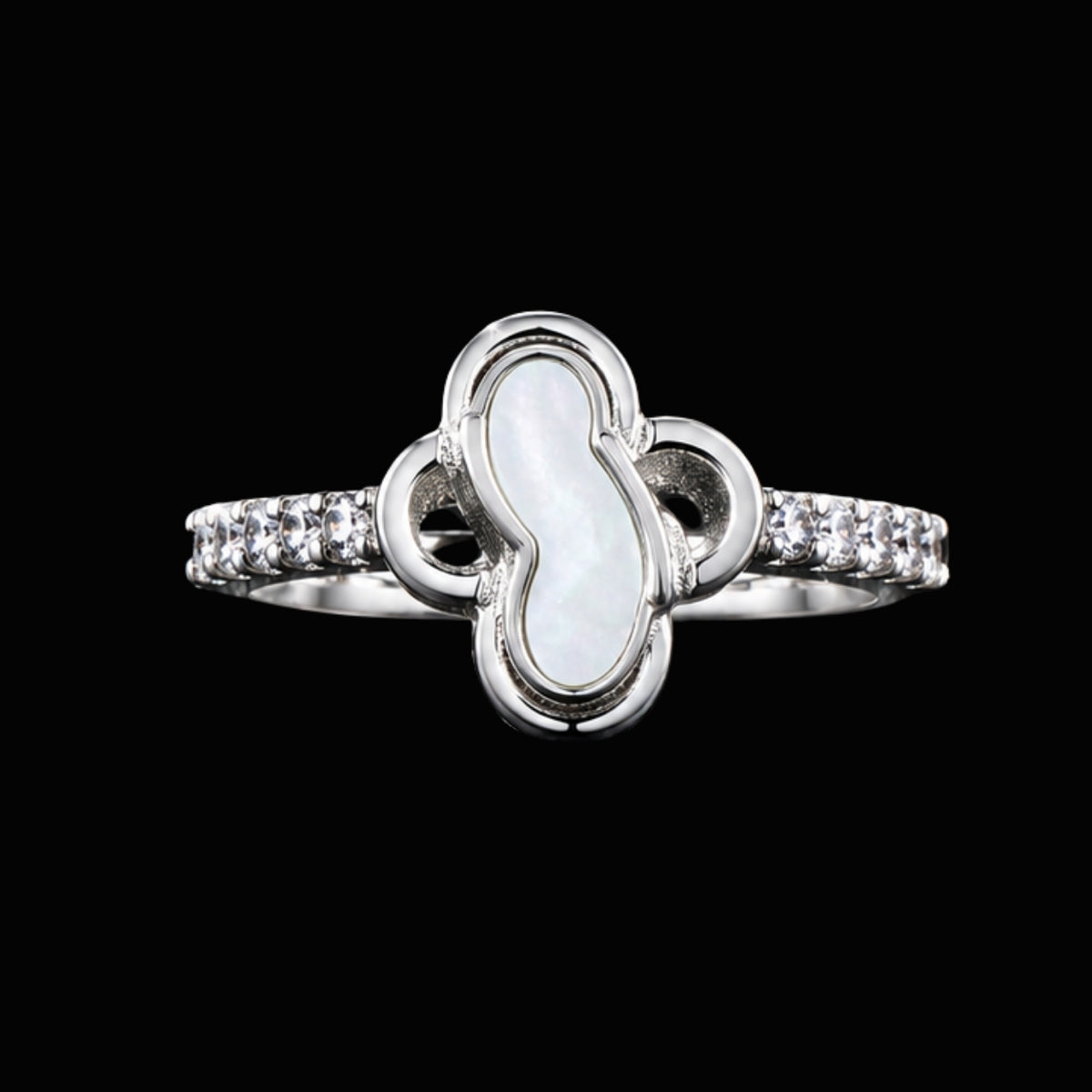 A silver ring with clear CZ stones on a black background.