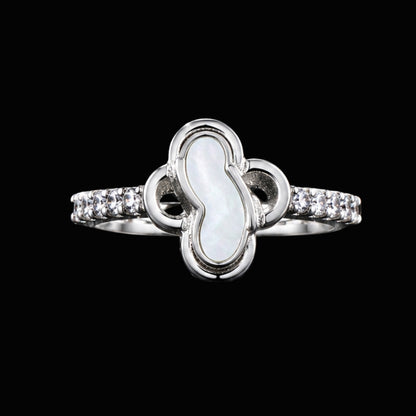 A silver ring with clear CZ stones on a black background.