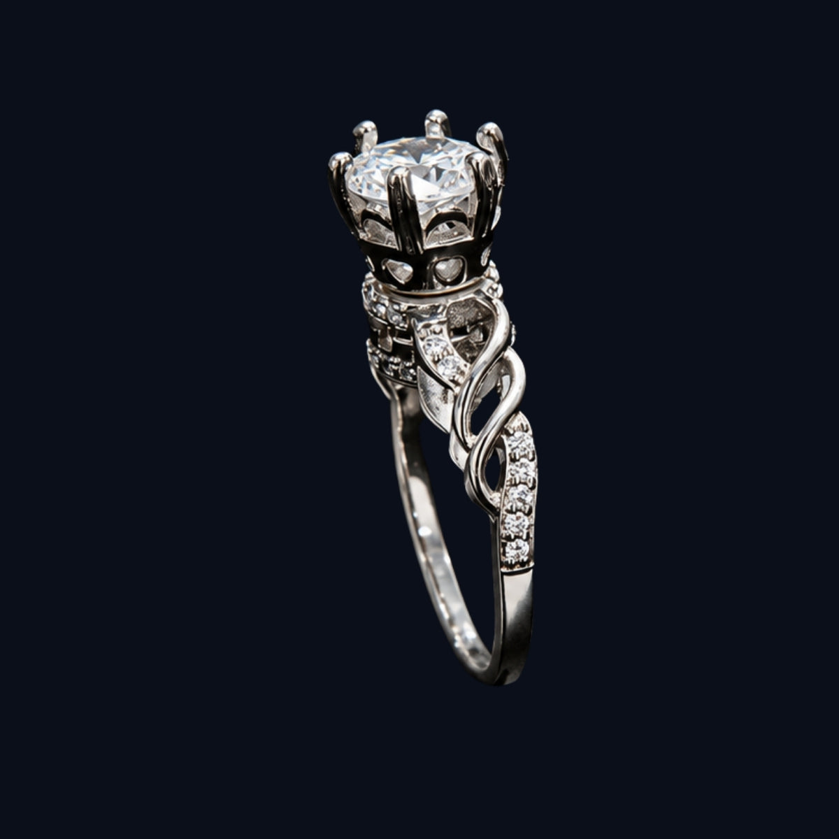 A silver ring with a crown design and clear CZ stones.