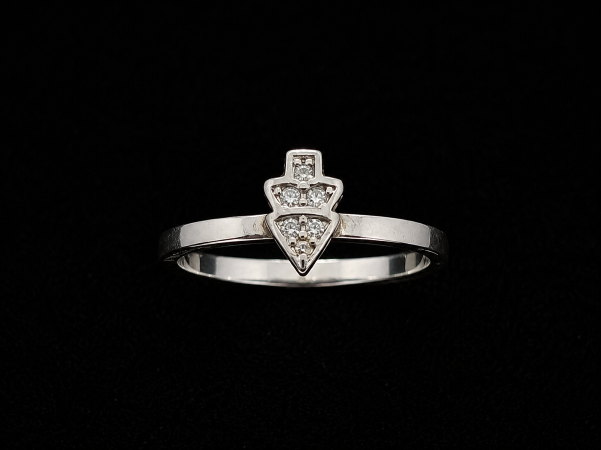 A silver-tone ring with a triangle motif and clear CZ stones.