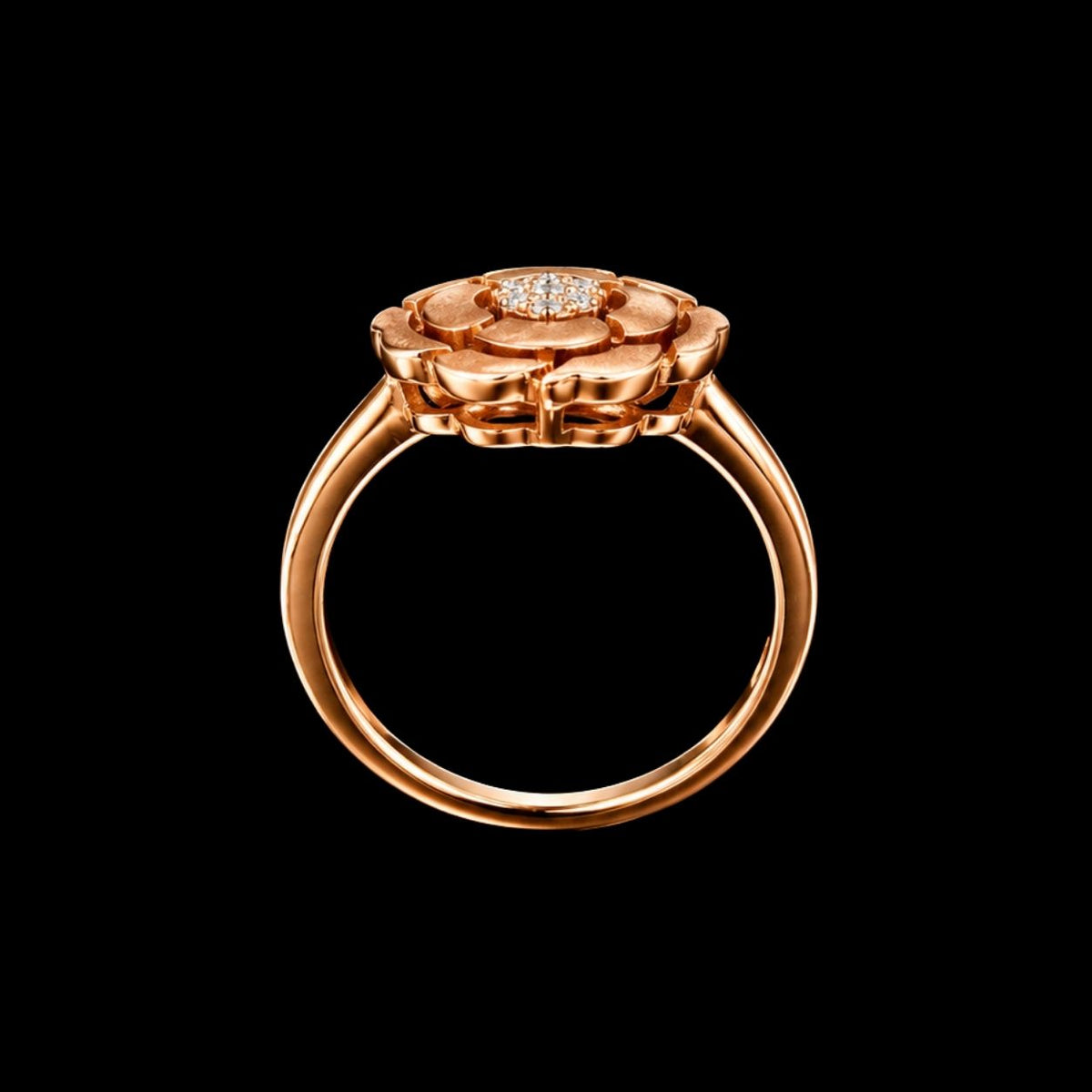 A rose gold ring with a flower design and a central CZ stone.
