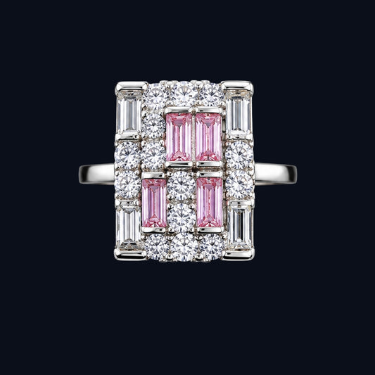 A silver-tone ring with pink and clear cubic zirconia stones in a geometric design.
