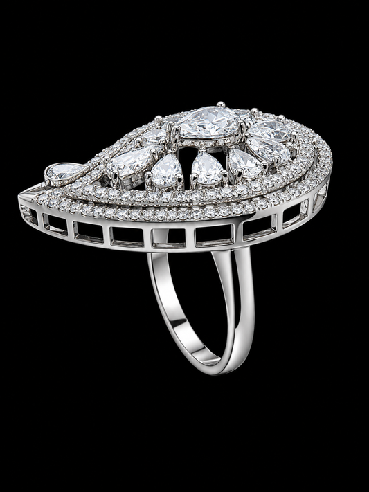 A silver-tone ring with a large round CZ stone and smaller CZ stones on a black background.