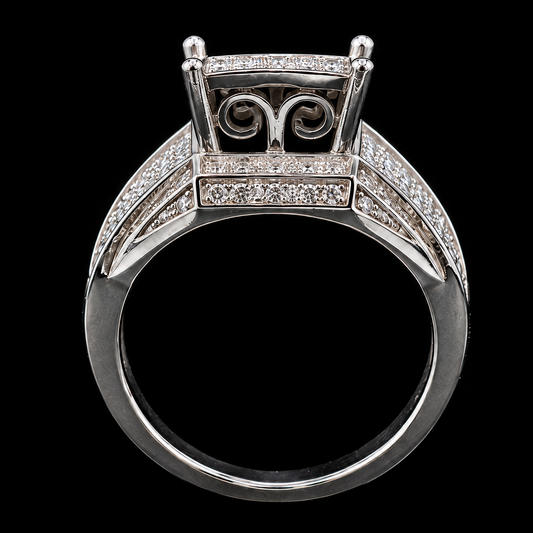 A silver ring with intricate details and sparkling CZ stones.