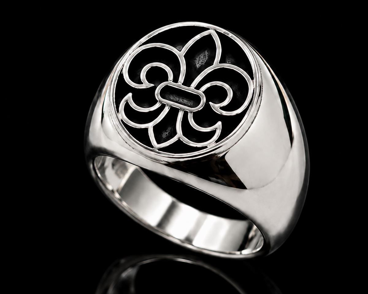 A silver ring with a fleur-de-lis design on a black background