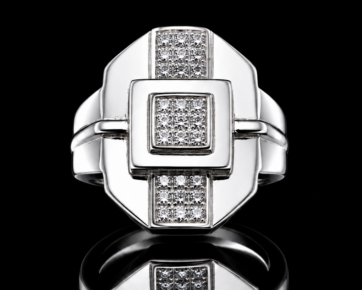 A silver ring with a square design and clear cubic zirconia stones.