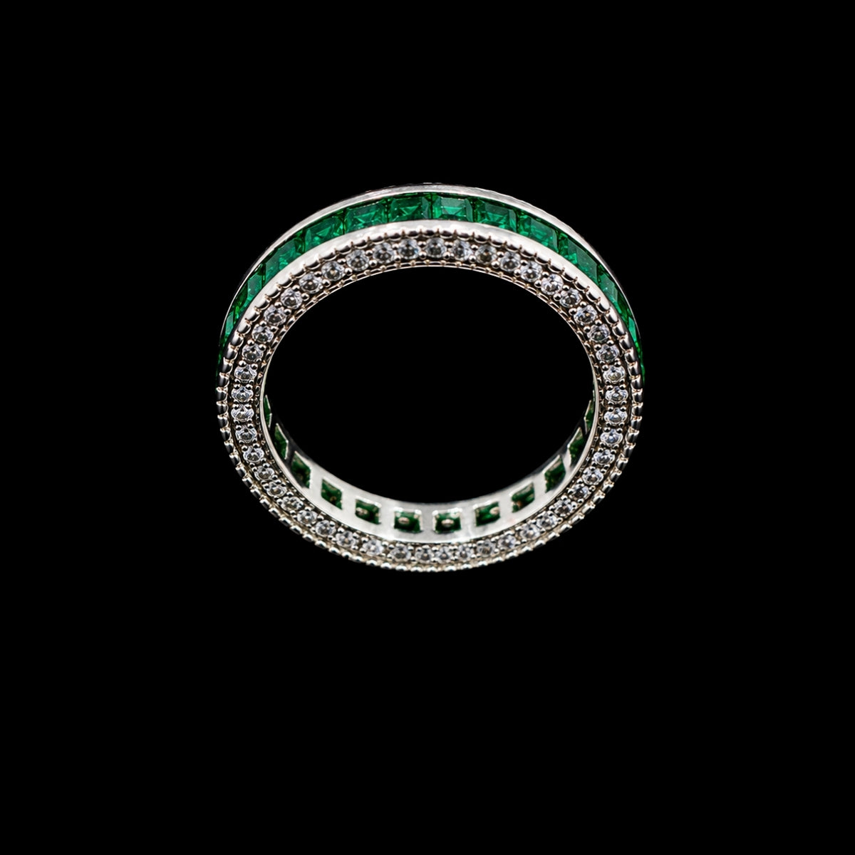 A silver-tone ring with a double row of emerald green and clear CZ stones.