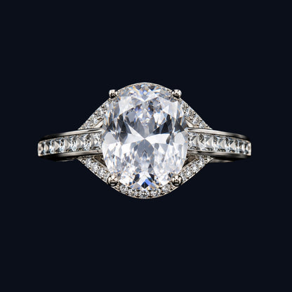 A silver ring with an oval-cut CZ stone, set in a geometric design.