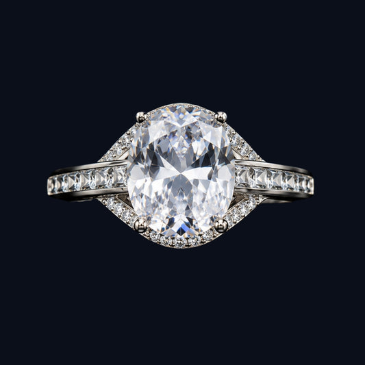 A silver ring with an oval-cut CZ stone, set in a geometric design.