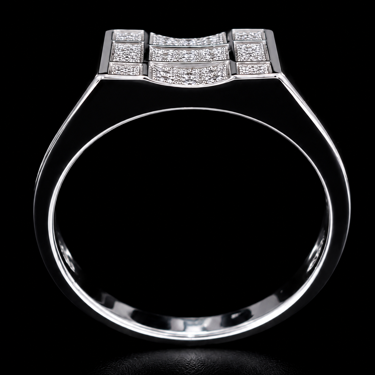 A silver ring with a geometric design and small CZ stones.