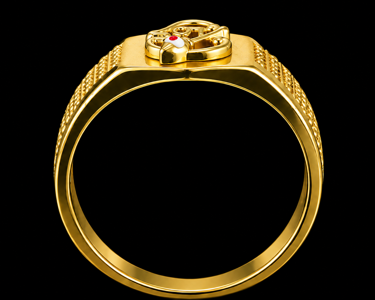 A gold ring with a red stone, set against a plain background.