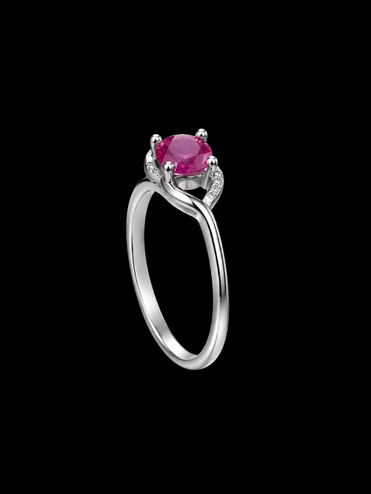 A silver ring with a pink gemstone in the center, set in a minimalist geometric design.