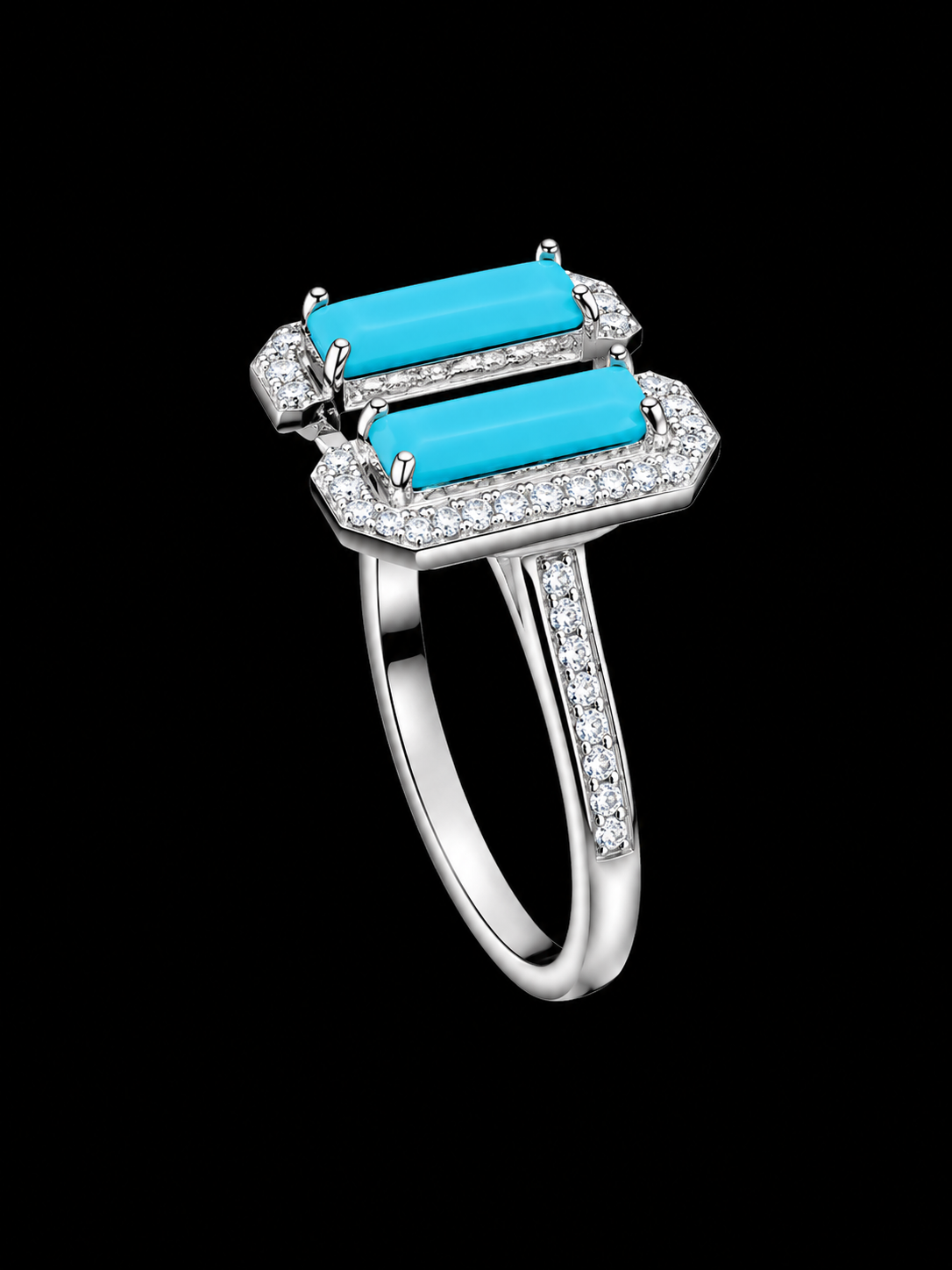 A silver-tone ring with two turquoise stones and clear cubic zirconia stones.