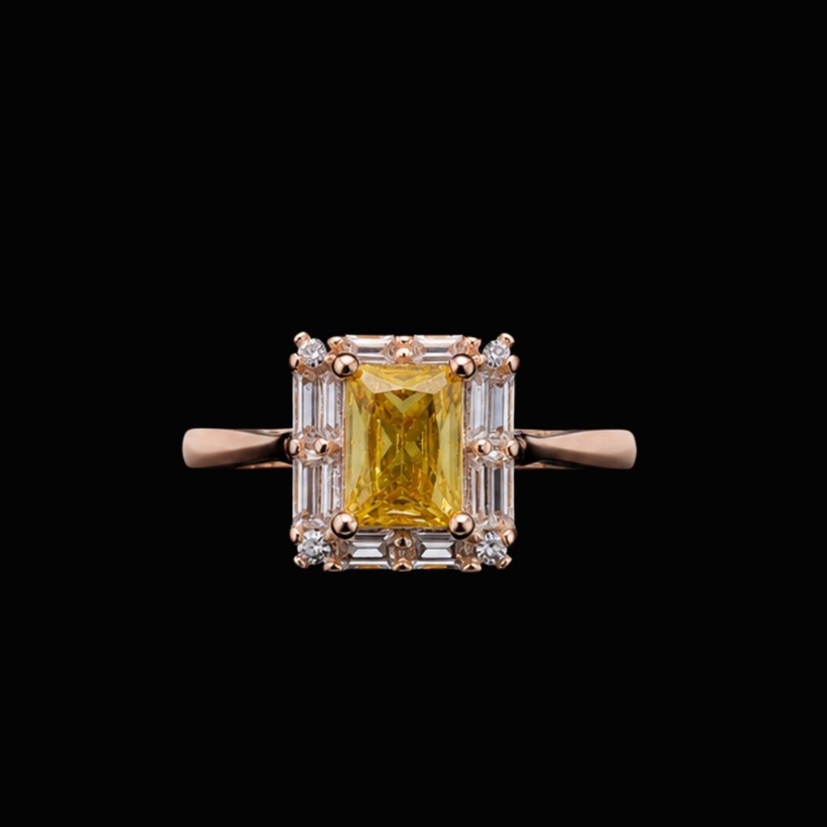 A yellow CZ stone ring with a rose gold band and clear CZ accents.