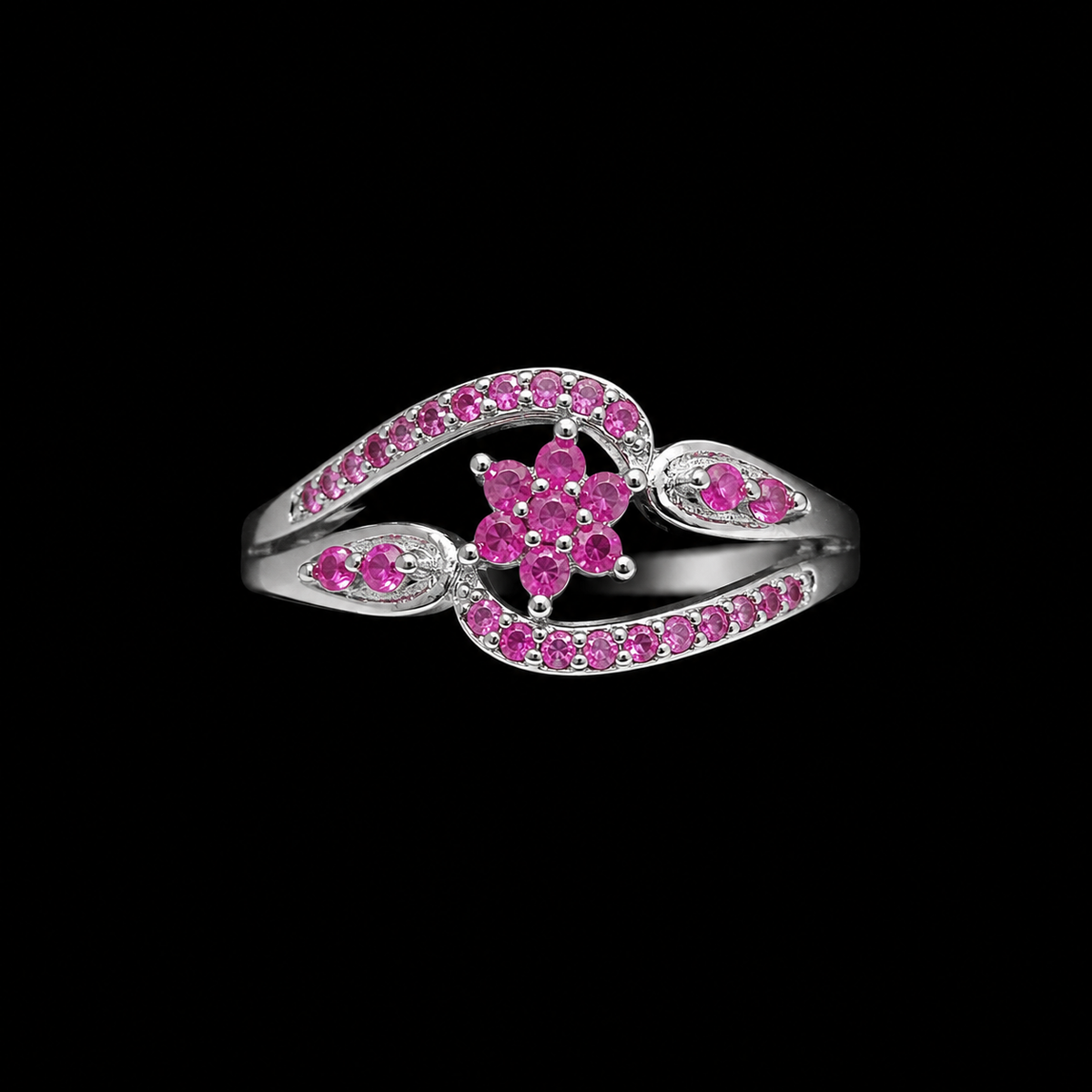 A silver ring with a floral design and pink CZ stones.