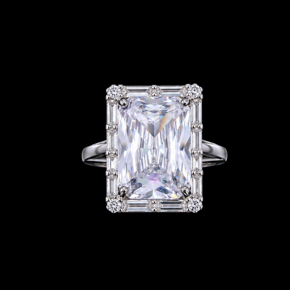 A silver ring with a large radiant-cut cubic zirconia stone and smaller stones set in a silver band.