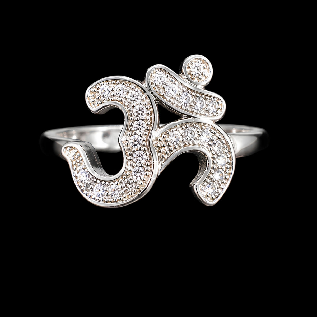 A silver ring with an Om motif and CZ stones.