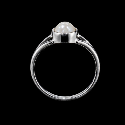 A silver-tone ring with a round pearl set in a silver-tone setting.