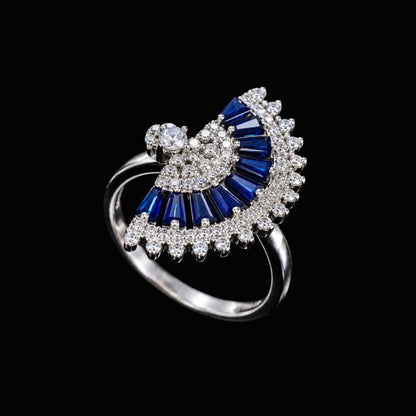 A silver ring with a blue CZ butterfly design.